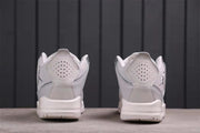 Rear view showing padded collars, perforated heel panels, and outsole edges.