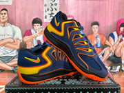 Pair of navy Nike basketball sneakers shown at an angle