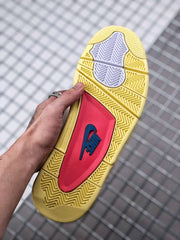 Outsole view showing the yellow patterned tread, white sections, and red-and-blue central panel.