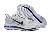 Pair of light grey Nike Pegasus Premium shoes shown from side and outsole angles