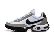 Side view of a white and grey Nike Air Max TW sneaker with a black Swoosh and visible air units.