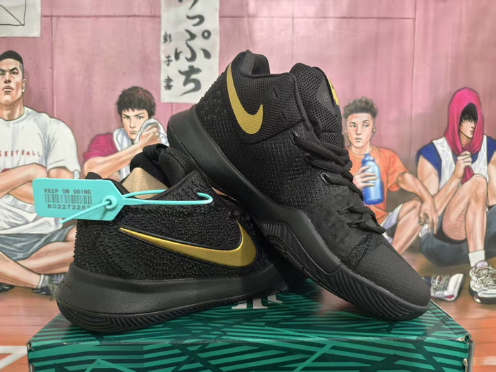 Pair of black Nike KD basketball sneakers with gold Swoosh details displayed on a shoebox.