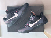 Pair of Kobe 11 basketball shoes shown from angled side views.