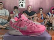Side profile of a pink Jordan sneaker showing layered side panels, a contrasting side logo, laces, and a textured rubber outsole.