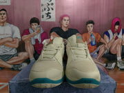 Front view of the Nike basketball sneakers showing mesh uppers, lace fastening, padded tongues, and teal toe accents.