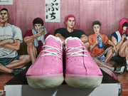 Front view showing the pink uppers, white laces and translucent outsoles