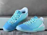 Top and side view showing light blue laces, blue toe panels and patterned translucent uppers.