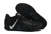 Side and outsole view highlighting the textured black tread and silver side swoosh.
