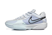 Side profile of a Nike GT Cut sneaker showing the black Swoosh, light blue side panel, and low-profile construction.