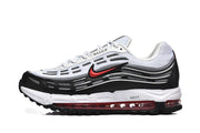 Side view of white, black, and red Nike Air Max 97 OG sneakers.