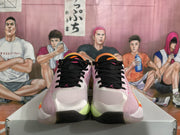 Front view of the pair showing black laces, pink side panels, light-colored toe boxes and lime outsole accents.