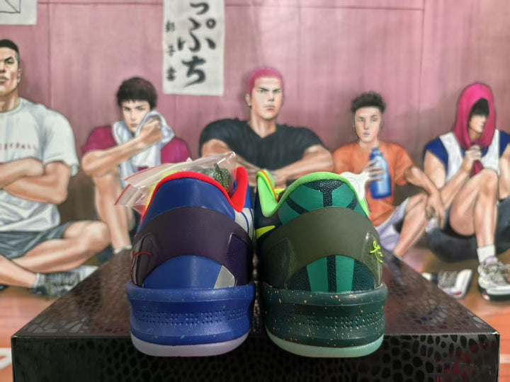 Rear view of a mismatched sneaker pair showing blue and dark green heel sections with contrasting red and lime-green collar details.