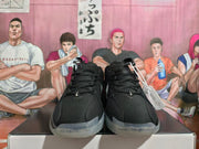 Front view of the black Nike basketball shoes with perforated uppers and translucent outsoles.