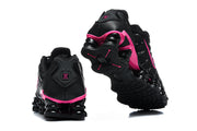 Black and pink Nike Shox TL sneakers showing heel and outsole details