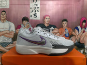 Side view of a gray and white Nike basketball shoe with a purple-accented Swoosh.