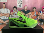 Side view of a green basketball shoe with a black Swoosh and Kobe-style details