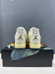 Rear view of the pair showing heel tabs, pale yellow midsoles, and gold-toned Jordan heel logos.