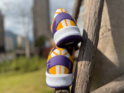 Rear heel view of the gold and purple Kobe 8 shoes
