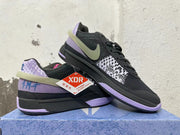 Angled view of black and lavender Nike basketball shoes with patterned side and heel details