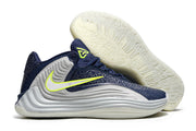Navy and gray Nike Giannis Immortality 7 shoe with outsole view
