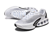 Pair of white Nike Air Max DN sneakers shown from above and at an angle.