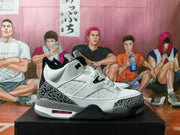 Side view of a white and grey Jordan 4-style sneaker with black elephant-print overlays.