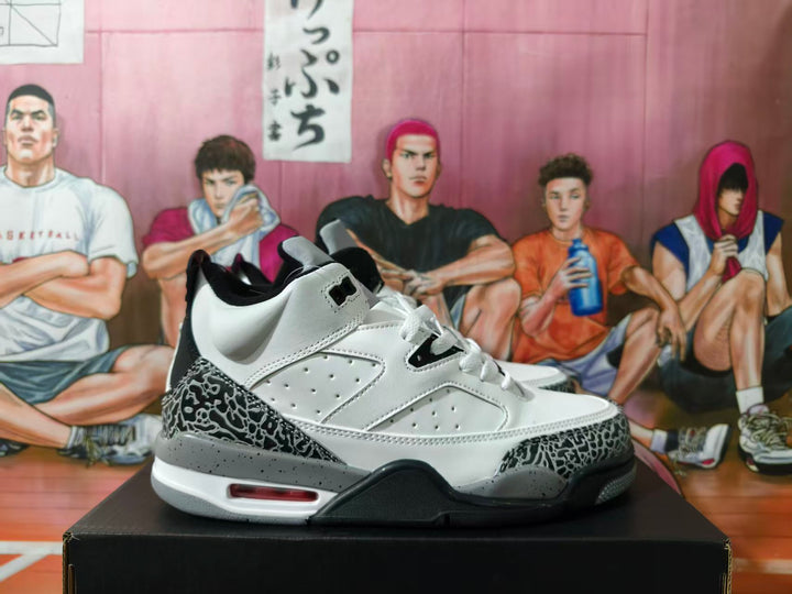 Side view of a white and grey Jordan 4-style sneaker with black elephant-print overlays.