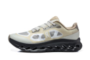 Side view of an On Cloudtilt Remix sneaker in cream, beige, gray, and black.