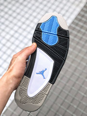 Outsole view showing black, blue, white, and light gray sections with a patterned tread.