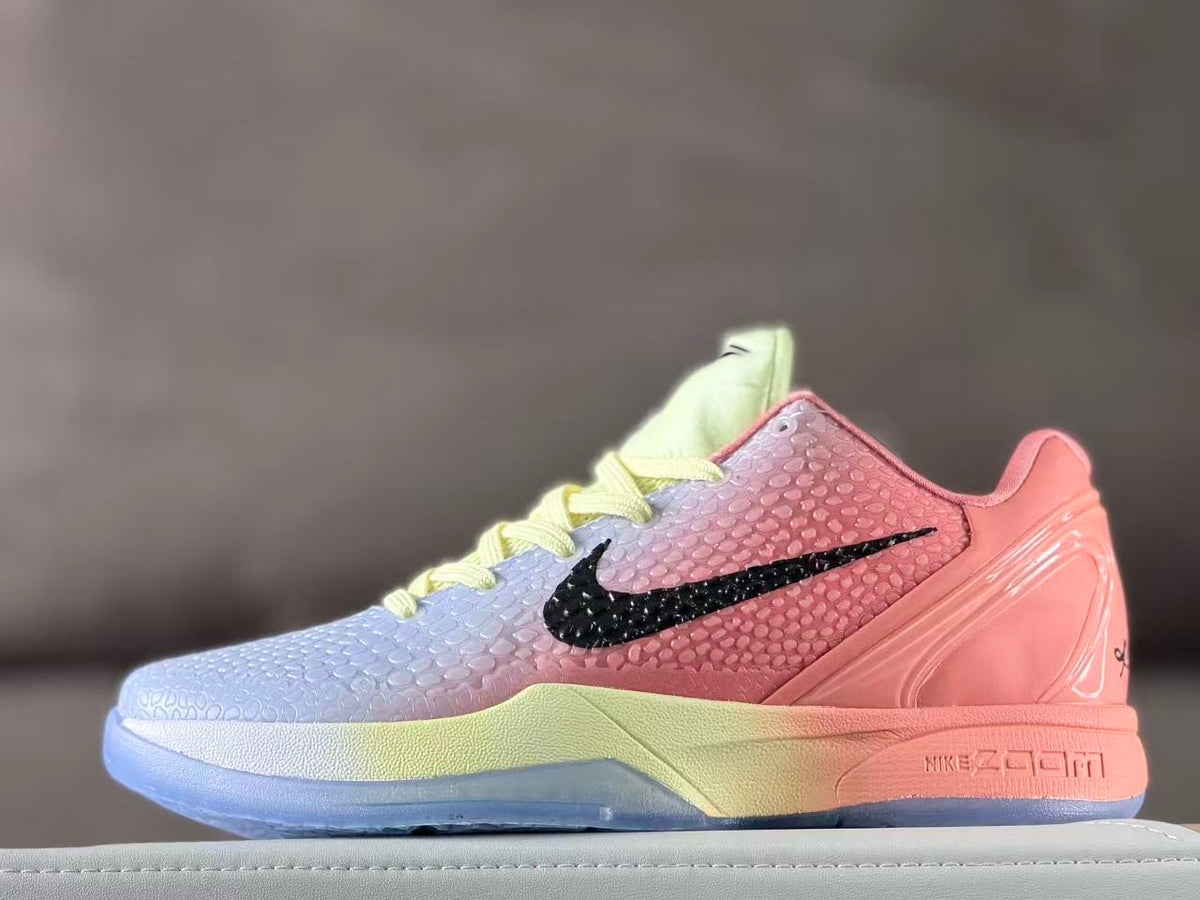Side profile of pink and pale blue basketball sneakers with pale yellow laces and a translucent blue outsole.
