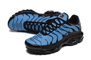Blue-and-black Nike Air Max Plus sneakers shown at an angled side view