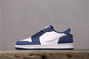 Opposite side profile of the white and navy low-top sneaker.