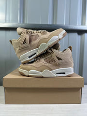Tan high-top sneakers displayed from the lateral and medial sides on a shoebox.