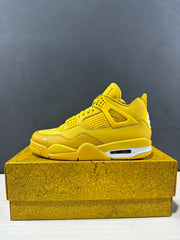 Side profile of a yellow high-top Jordan Air Jordan 4 sneaker with mesh panels and molded eyelets.