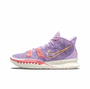 Lavender Nike Kyrie 7 basketball sneaker with gold Swoosh branding, pink accents, and a speckled white midsole.