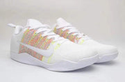 Pair of white lace-up low-top sneakers with multicolor rainbow-patterned side panels.