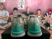 Rear view showing the teal heel sections, patterned beige uppers, multicolor collar lining, and speckled midsoles.