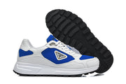 White and blue sneakers shown beside a black treaded outsole.