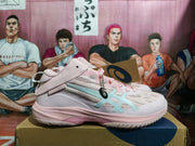 Side profile of a pink and white ASICS basketball shoe with pale blue stripes