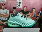 Side view of lake-green Nike basketball shoes showing sculpted sidewalls and dark Swoosh branding
