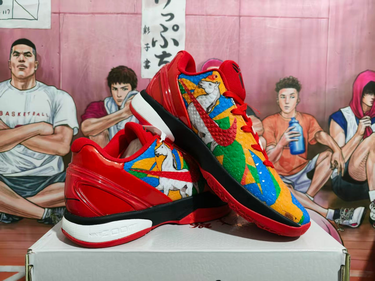 Pair of red and multicolor Nike basketball sneakers displayed on a box, showing the patterned upper, black midsole section, and white foam midsole.