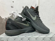 Pair of dark Nike Kobe 6 shoes shown from the side, highlighting the textured finish and heel design