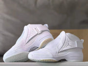 Pair of white high-top sneakers displaying the side panels and outsole details.