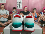 Rear view of the pair showing white mesh-like heel sections, teal gradient heel panels, red collars, and signature-style heel graphics.