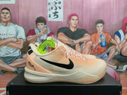 Side view of pale pink and cream Nike Kobe 8 Protro basketball shoes with black Swoosh and neon yellow-green spare laces