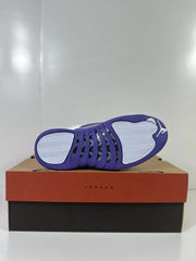 Outsole view showing the purple and white tread of an Air Jordan 12 Retro