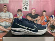 Side profile of a navy and white basketball sneaker with a large contrasting Swoosh and layered white midsole.