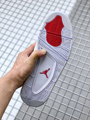 Outsole view showing the white patterned tread and red central traction section.