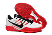 Side view of a shoe alongside its red patterned outsole.