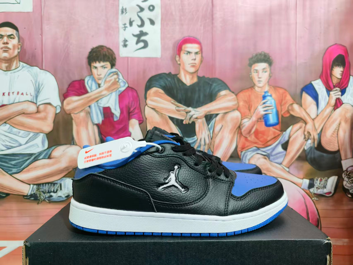 Side view of black and blue Jordan low-top sneakers on a box